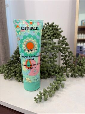 amika Mint Green Bond Repair Hair Mask with Colorful Floral Graphic